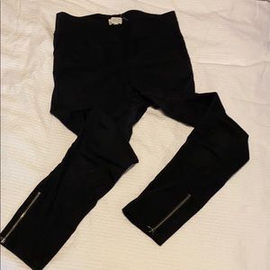 Black suede leggings with zippers on bottom